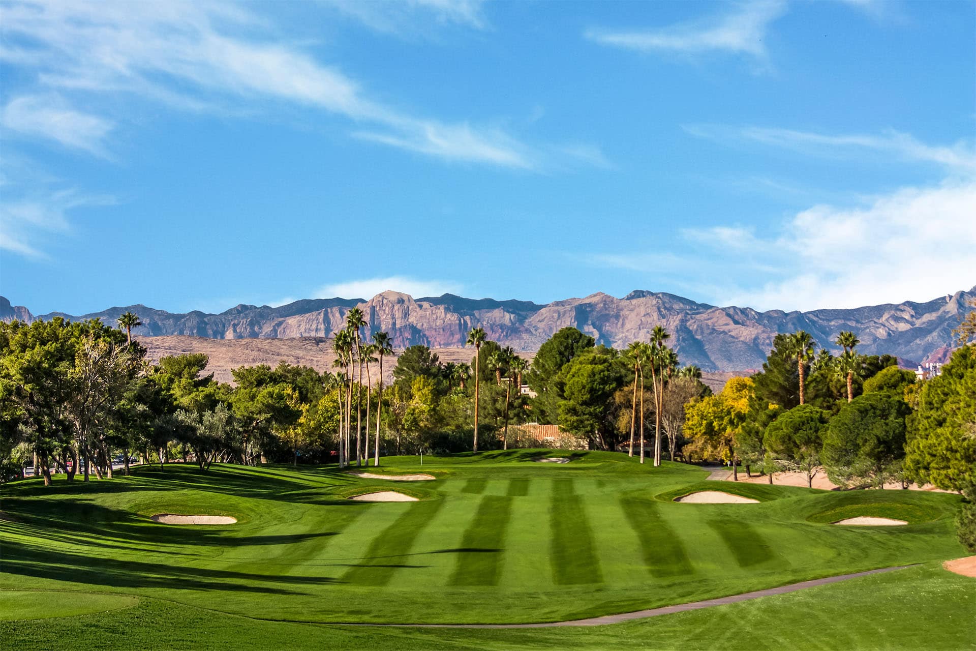 Golfer taking a swing on a beautiful course